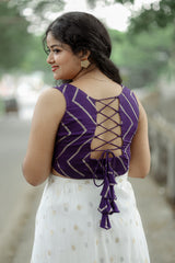 Crop top with lose bottom and a cape around the waist